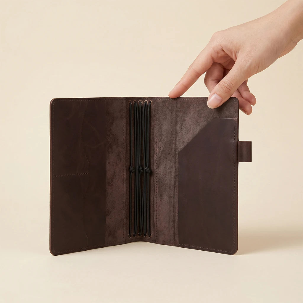 Leather writing journal cover with pockets and five elastic notebook holders