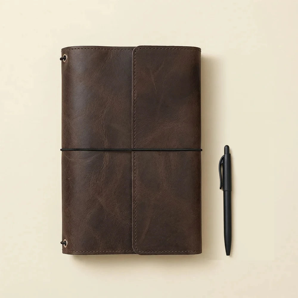 Durable brown leather journal cover featuring three elastic bands and spacious inside compartments.