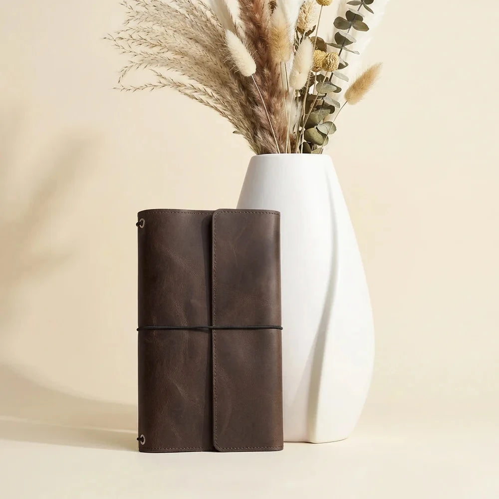 Brown genuine leather notebook cover featuring three elastics and functional inside card compartments