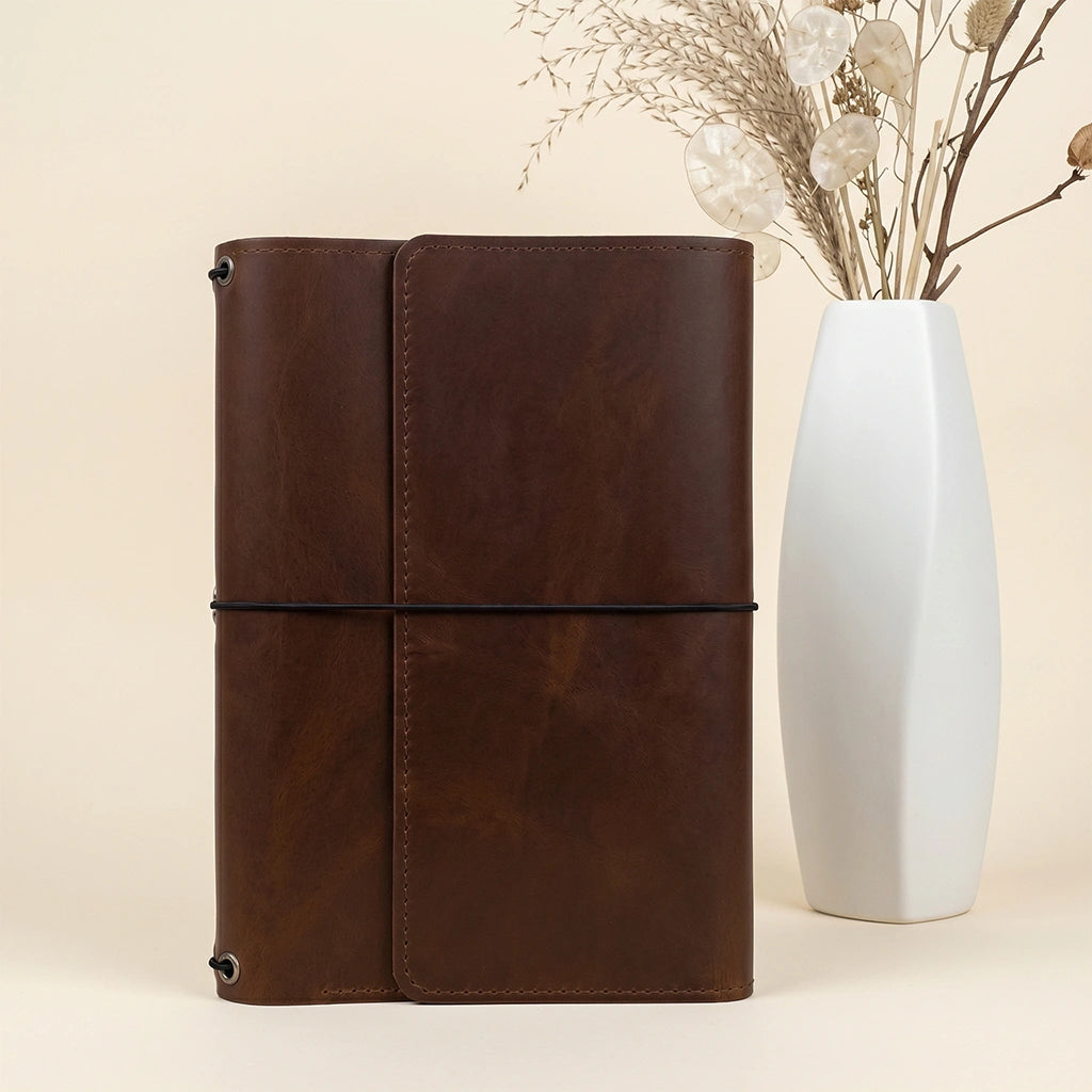 Genuine leather notebook carrier with practical compartments and flexible elastic notebook holders.