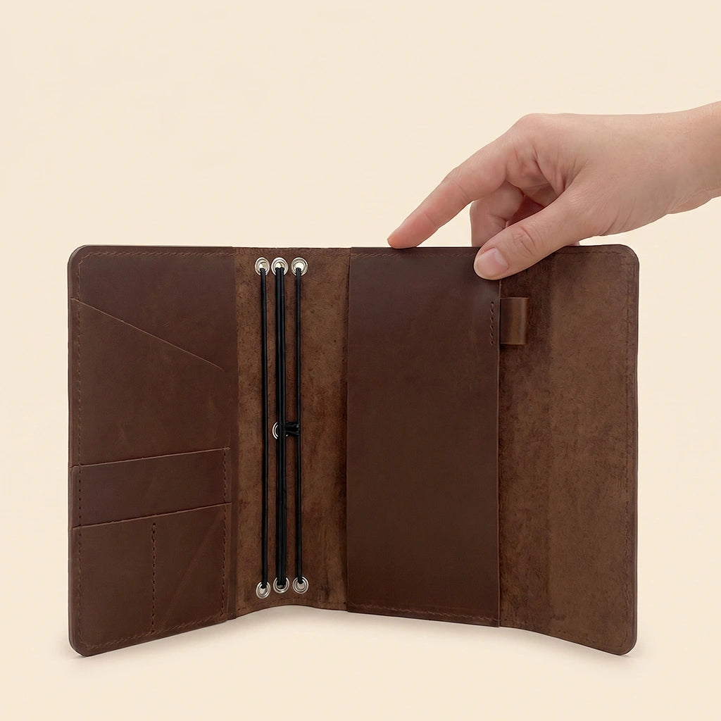 Genuine leather journal cover designed with storage pockets and pen holder loop.