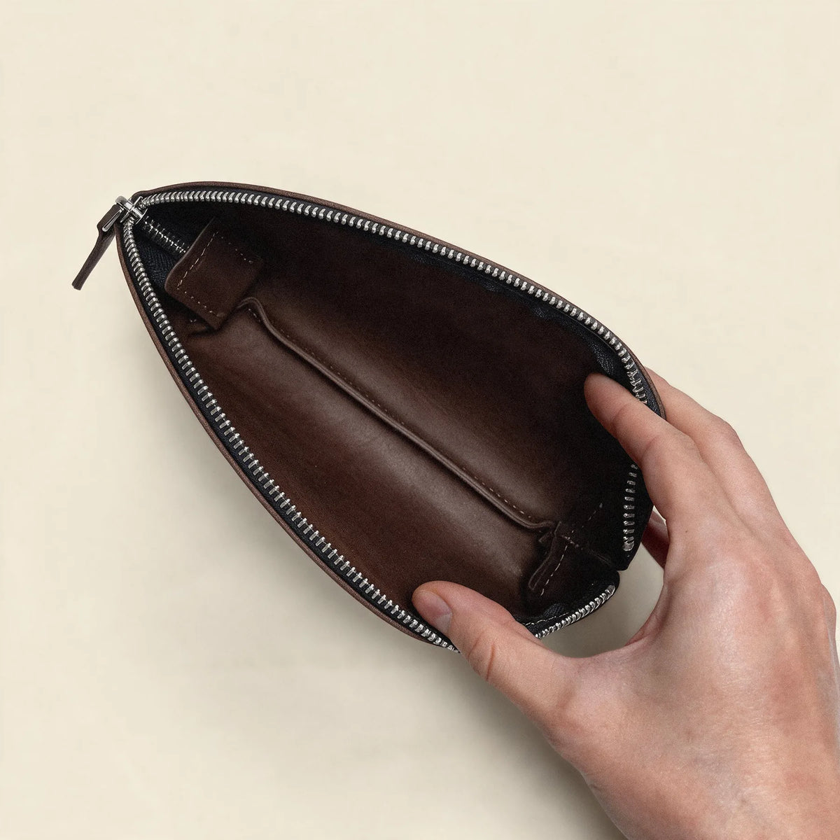 Elegant natural leather cosmetic pouch designed with a reliable zipper closure