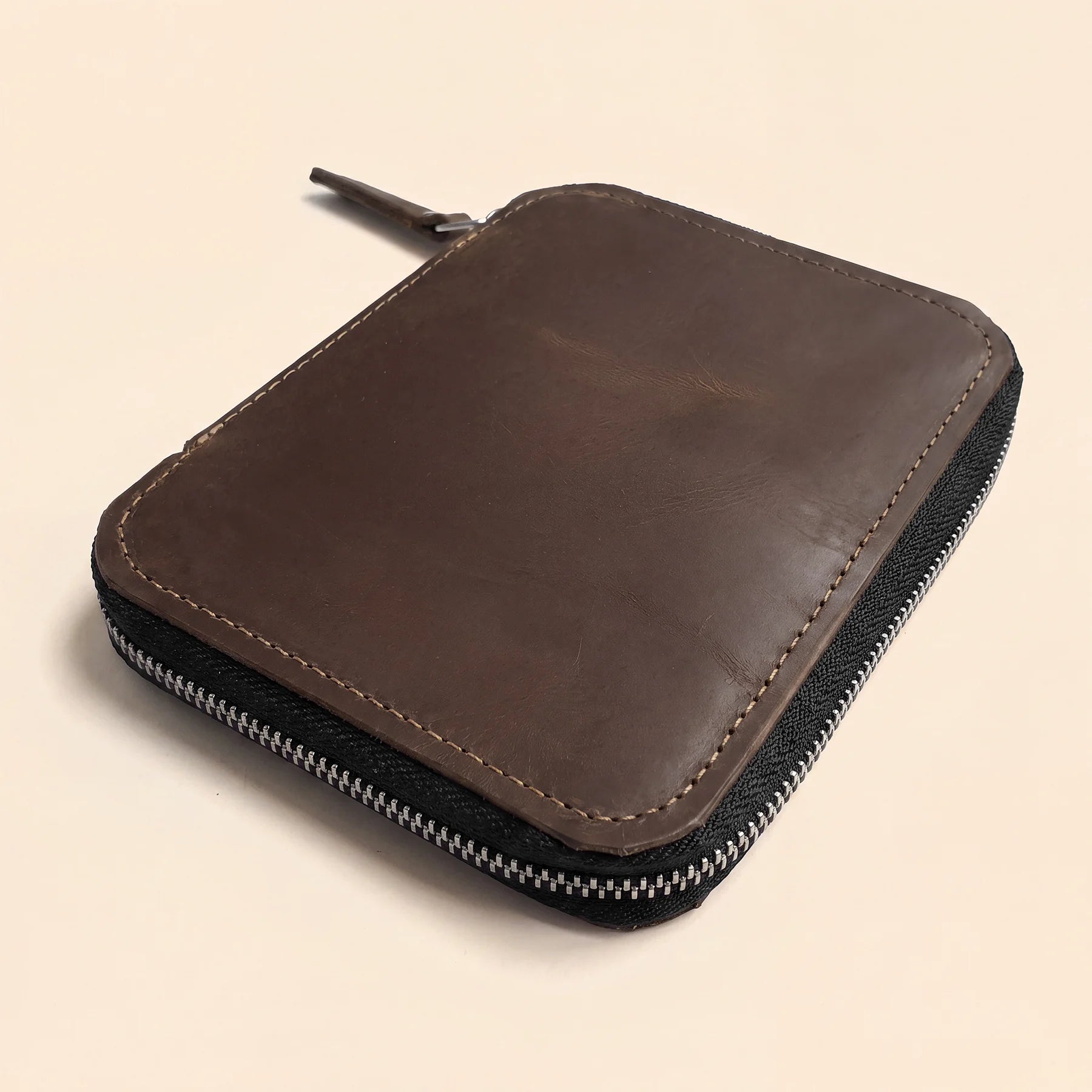 Leather pen organizer handcrafted with zipper closure for business and travel use.