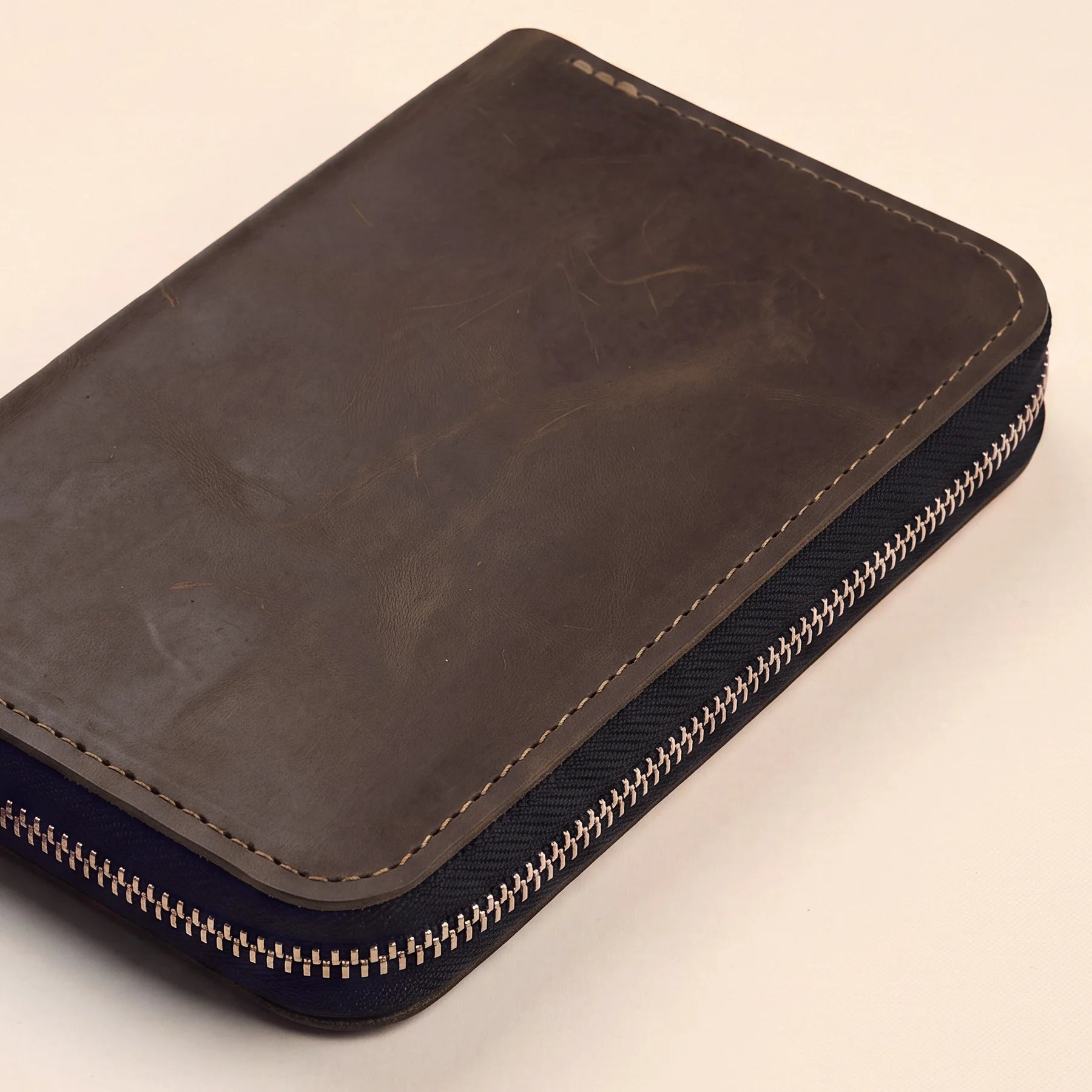 Premium leather pencil pouch with zipper for organized writing tools and accessories.