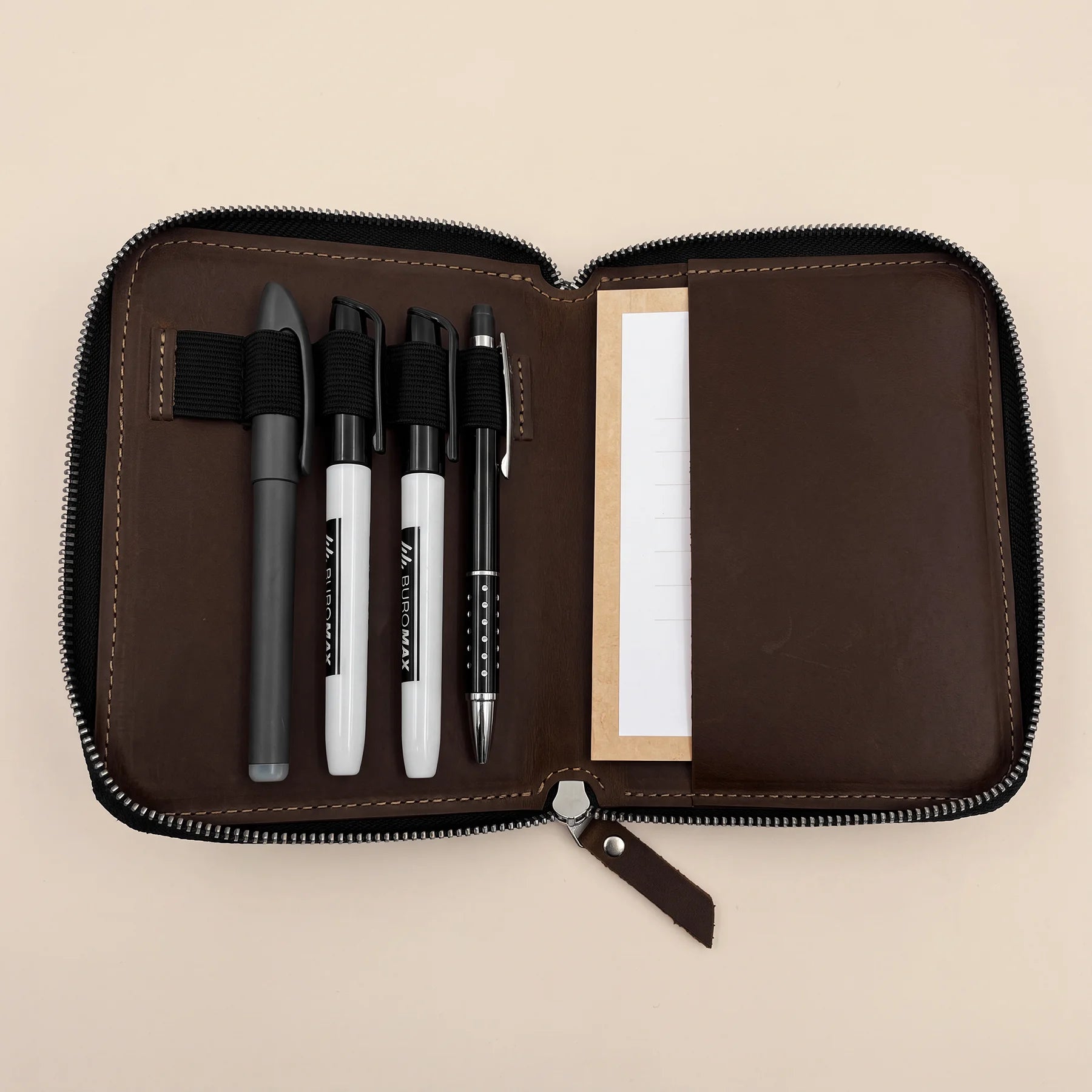 Compact leather pen wallet crafted with zip closure for organized everyday carry.