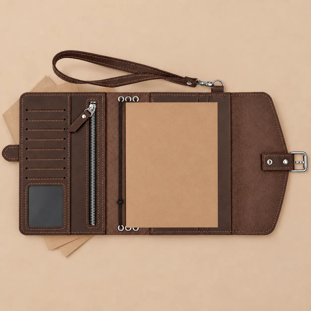 Handmade natural leather journal cover with interior pockets and secure wrist strap