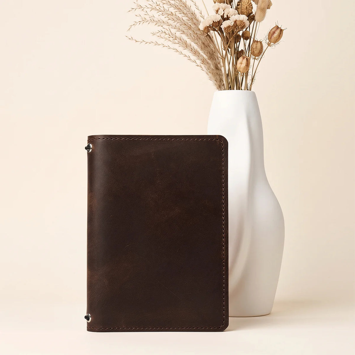 Genuine natural leather notebook sleeve with two secure straps and interior organization
