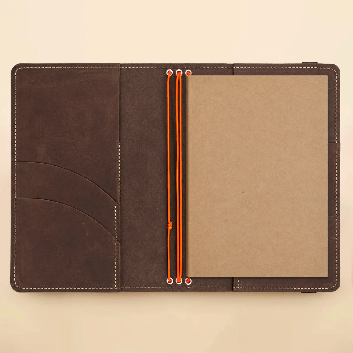 Handmade leather cover designed with three elastic bands, practical pockets, and transparent photo viewing window.