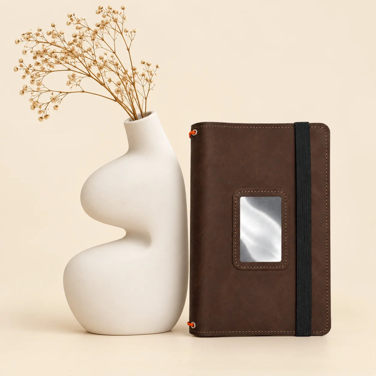 Handmade leather journal cover with three elastic holders and several useful pockets inside.