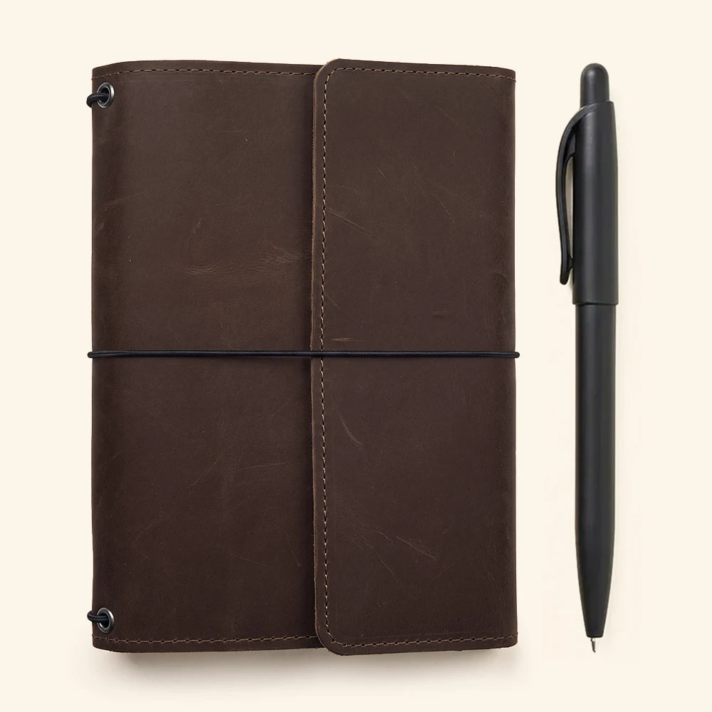 Handmade leather refillable journal organizer with spacious storage pockets and elastic notebook system.