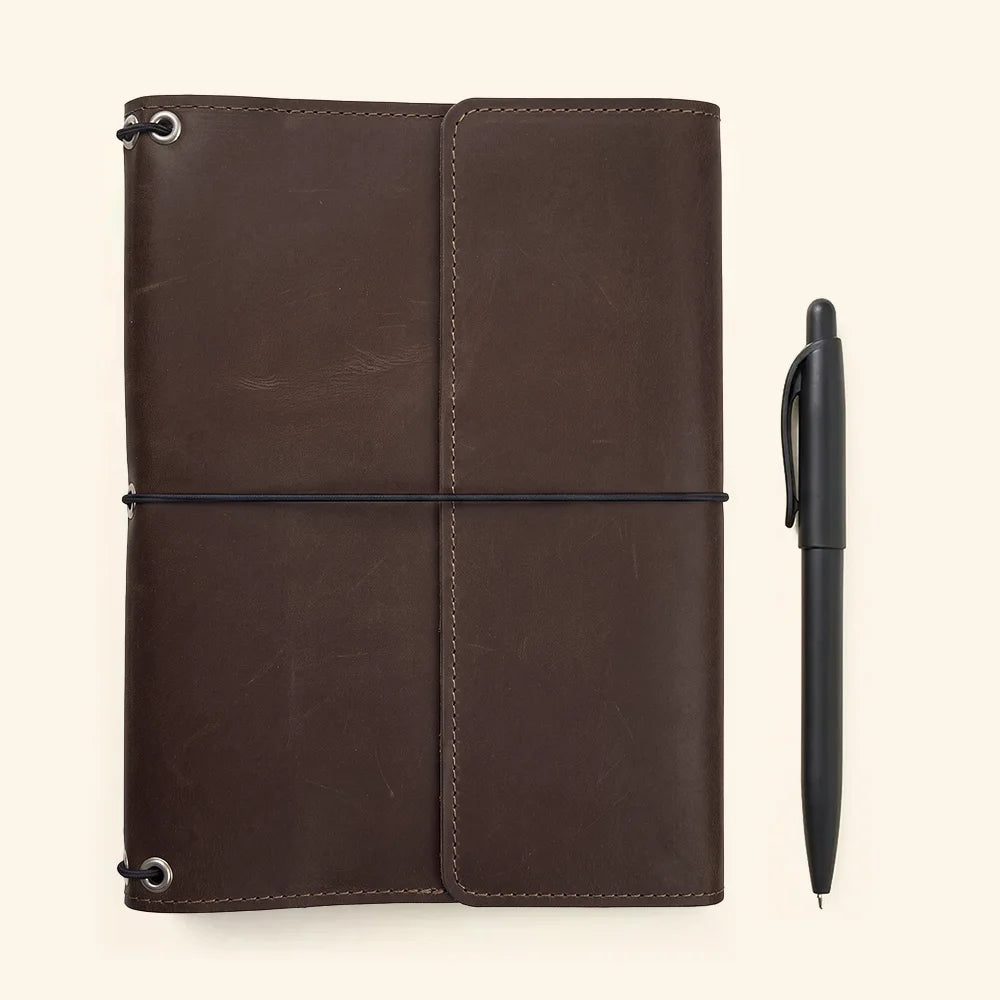 Handmade notebook organizer with premium leather finish and practical storage compartments inside.