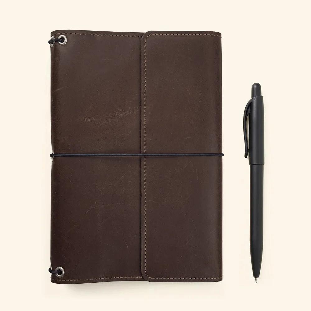 Handcrafted refillable leather journal featuring durable construction and versatile notebook insert system.