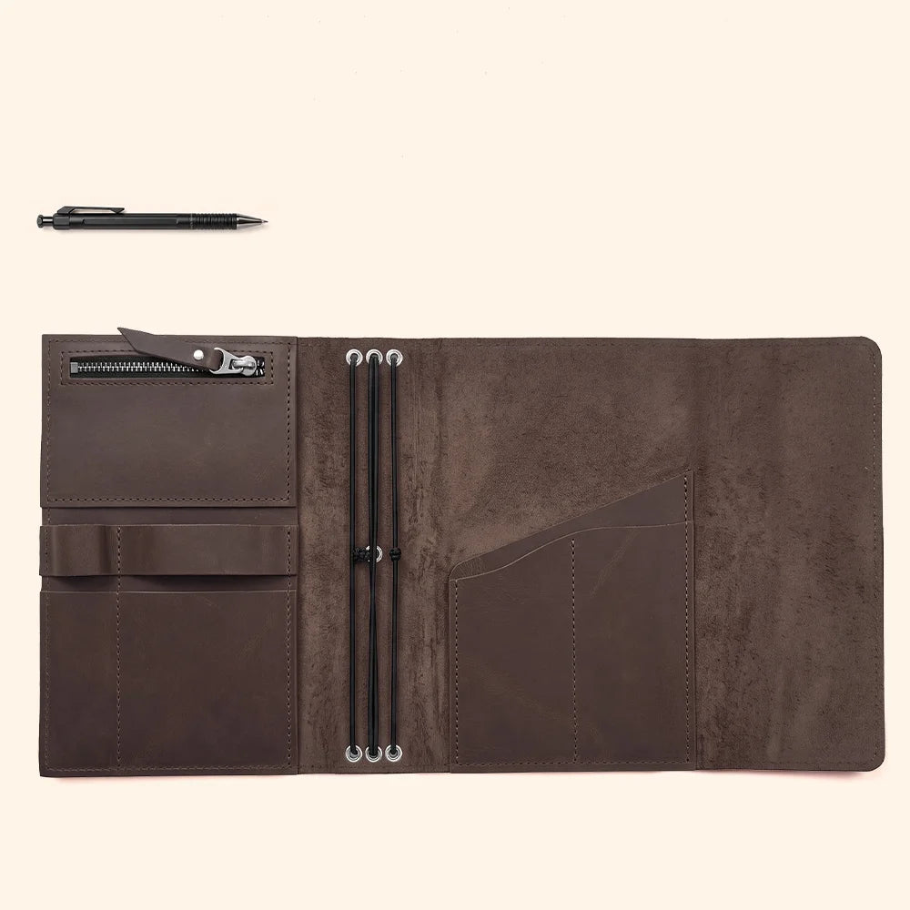 Artisan leather journal cover displaying functional compartments and a sturdy integrated pen loop.