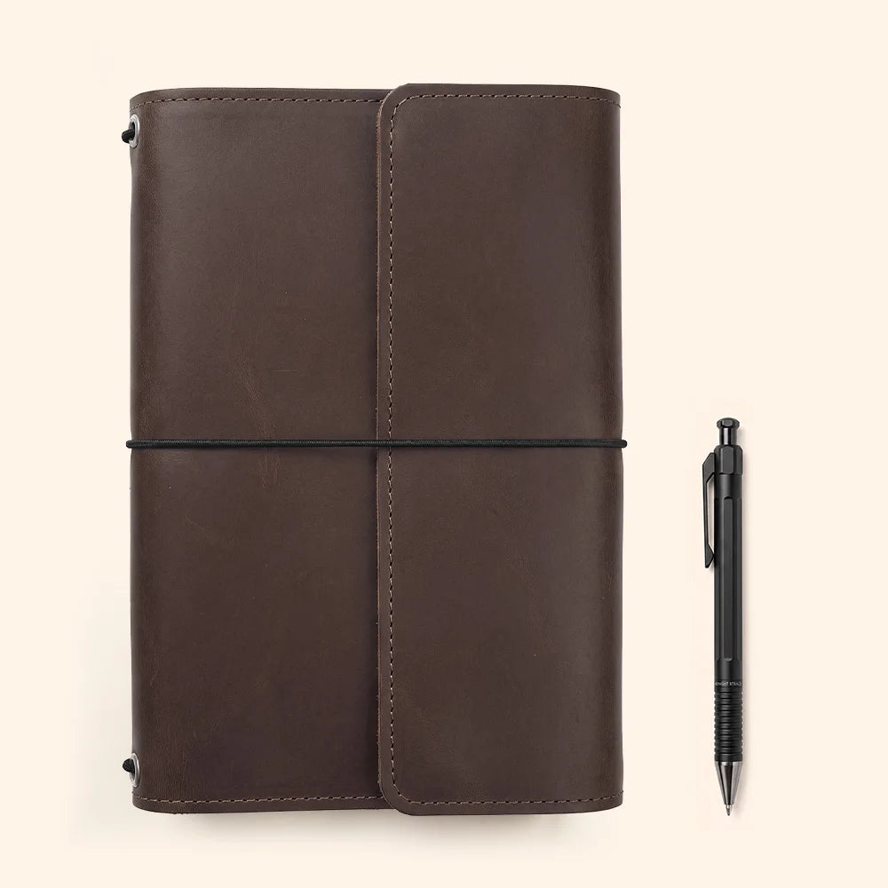 Handmade leather journal holder featuring spacious interior compartments and practical writing tool storage.