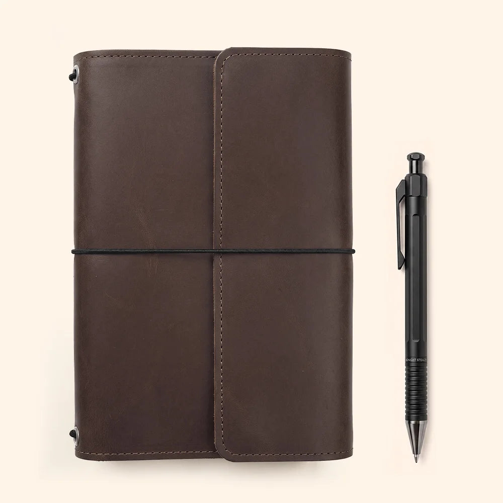 Rustic leather journal cover with practical inner storage areas and a dedicated pen attachment.