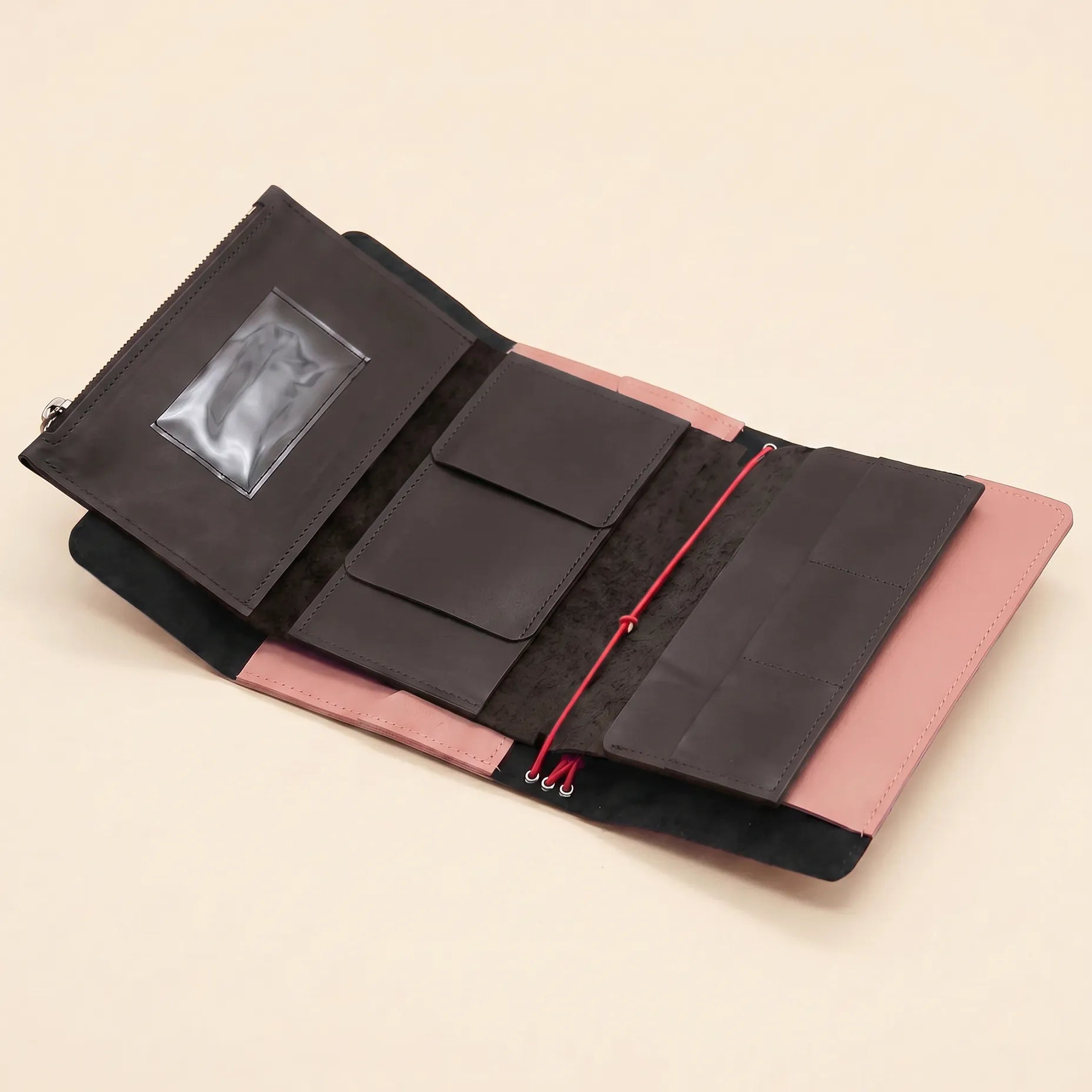 Compact leather notebook organizer with multiple pockets