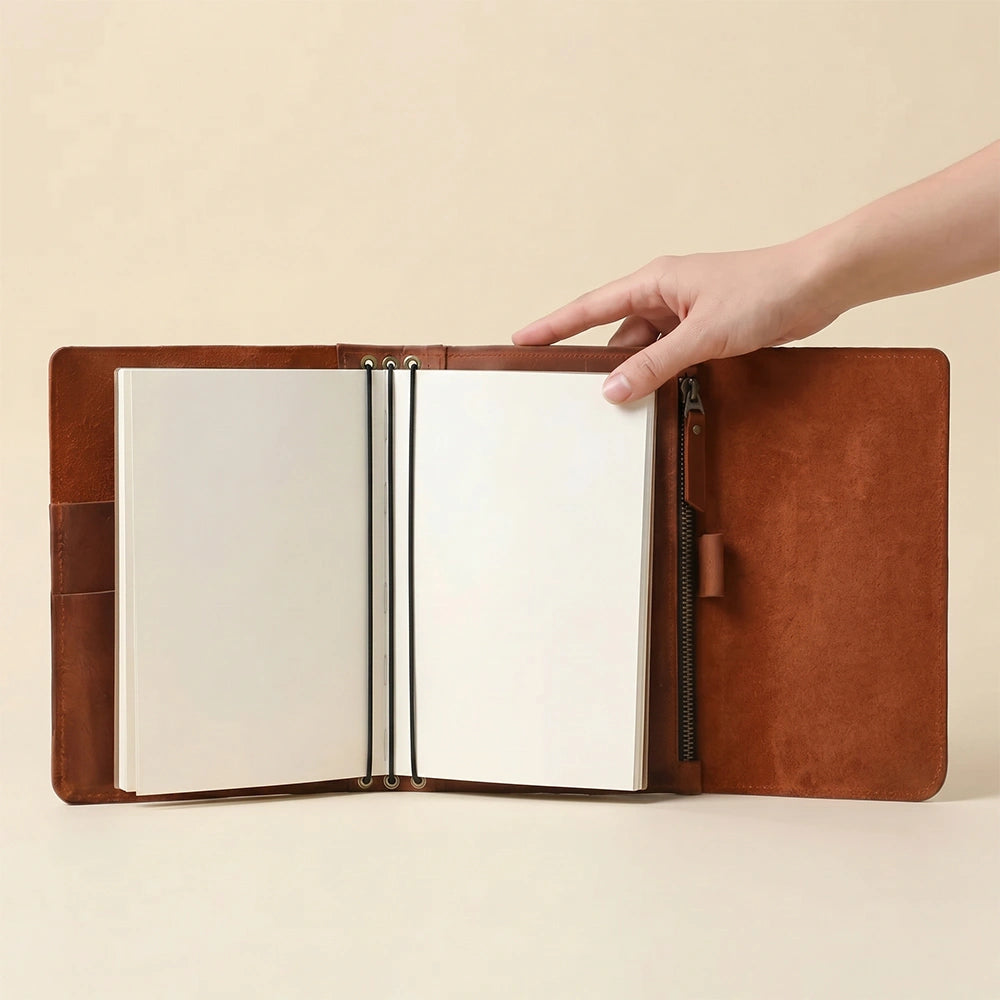 Leather journal cover with practical pockets, pen holder, and elastics.