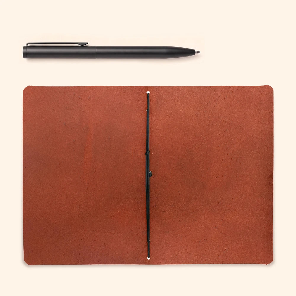 Genuine natural leather notebook cover featuring minimalist craftsmanship and clean interior details.