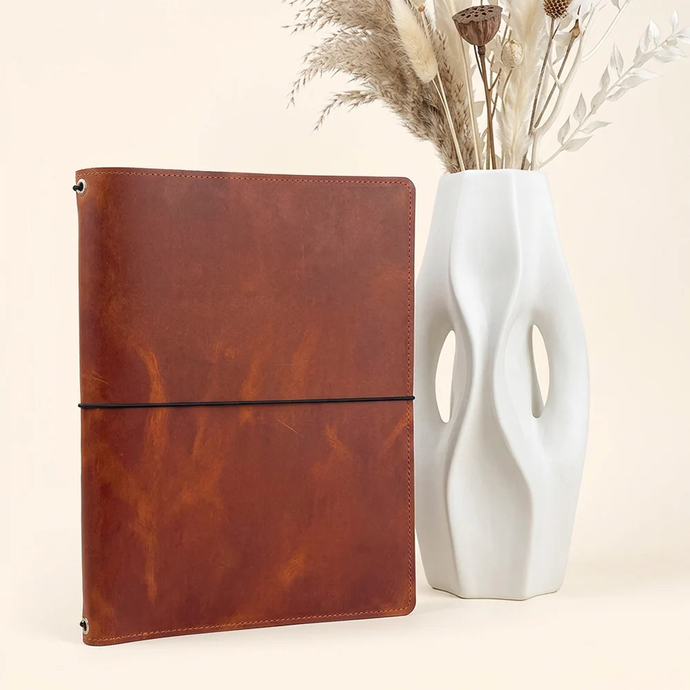 Handmade leather journal cover with three elastic bands, inner pockets, and sketchbook holder.