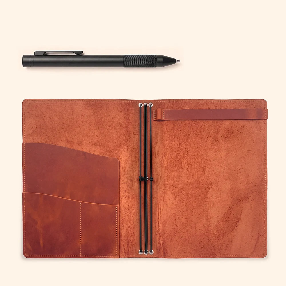 Genuine leather notebook cover with elastic bands, pockets, and sketchbook holder inside.