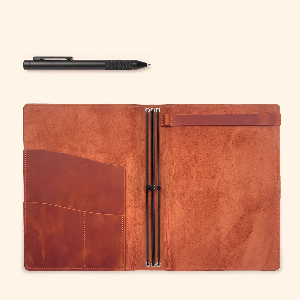 Open natural leather notebook cover featuring flexible insert holders and useful pockets.