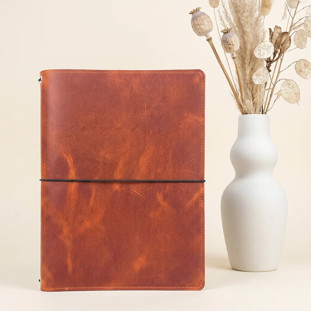 Open genuine leather notebook case built for journaling, planning, and sketching sessions.