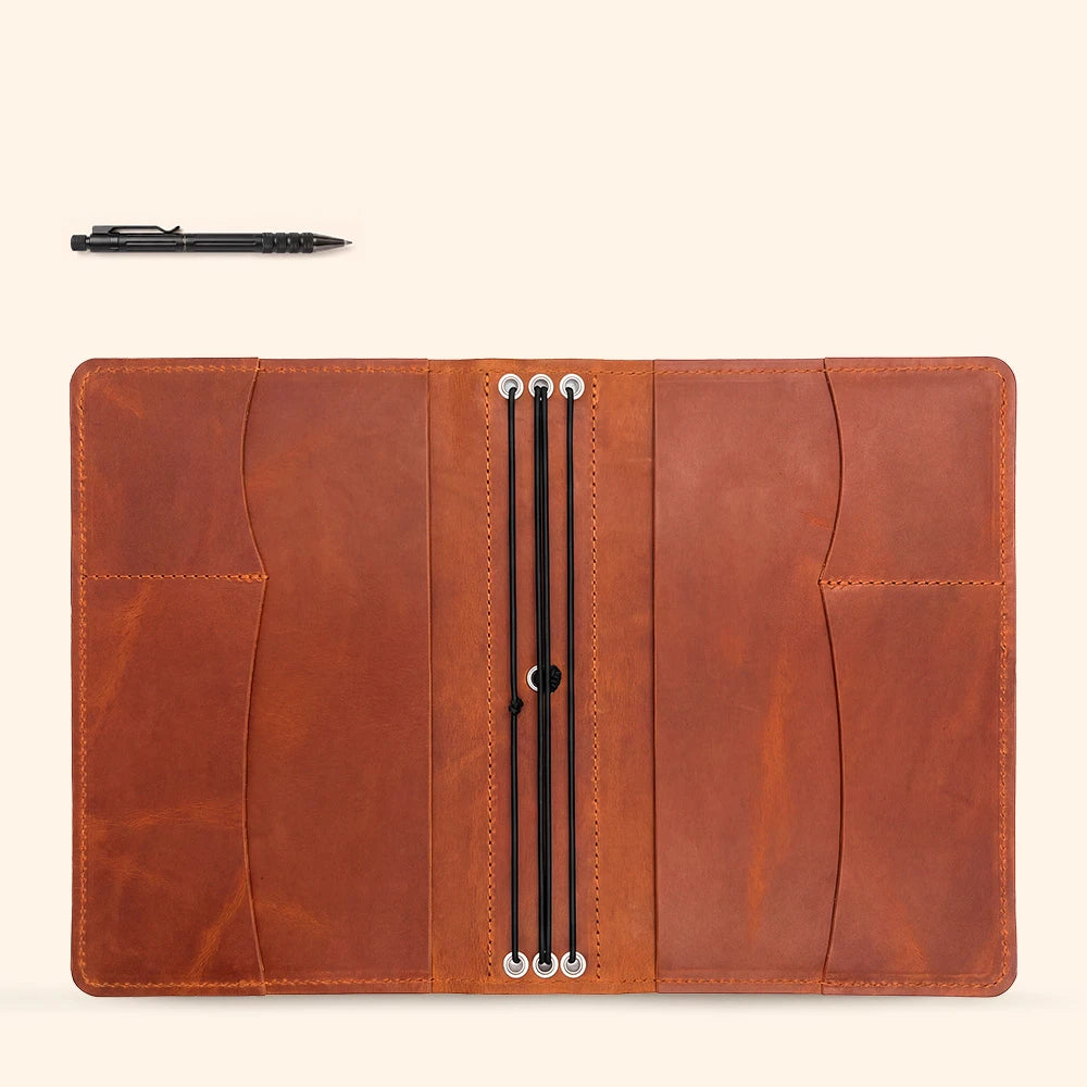 Genuine leather notebook cover with elegant design, organizer pockets, and secure pen keeper.