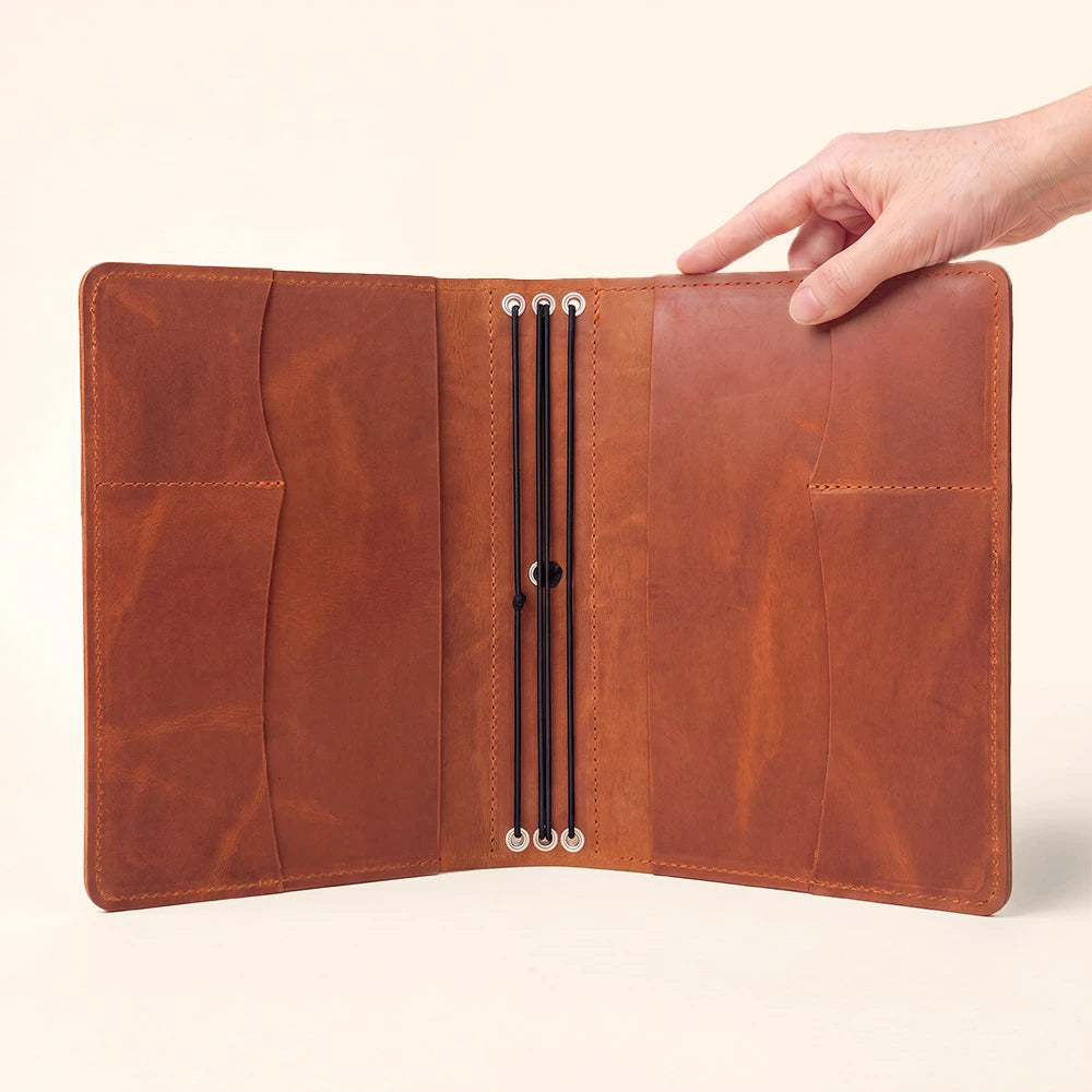 Leather notebook case offering premium organization with integrated accessory compartments.