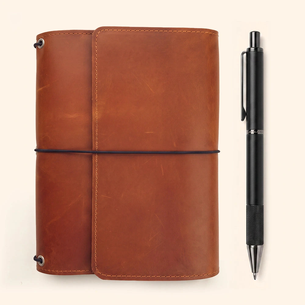 Refillable genuine leather notebook cover with functional interior pockets and pen holder.