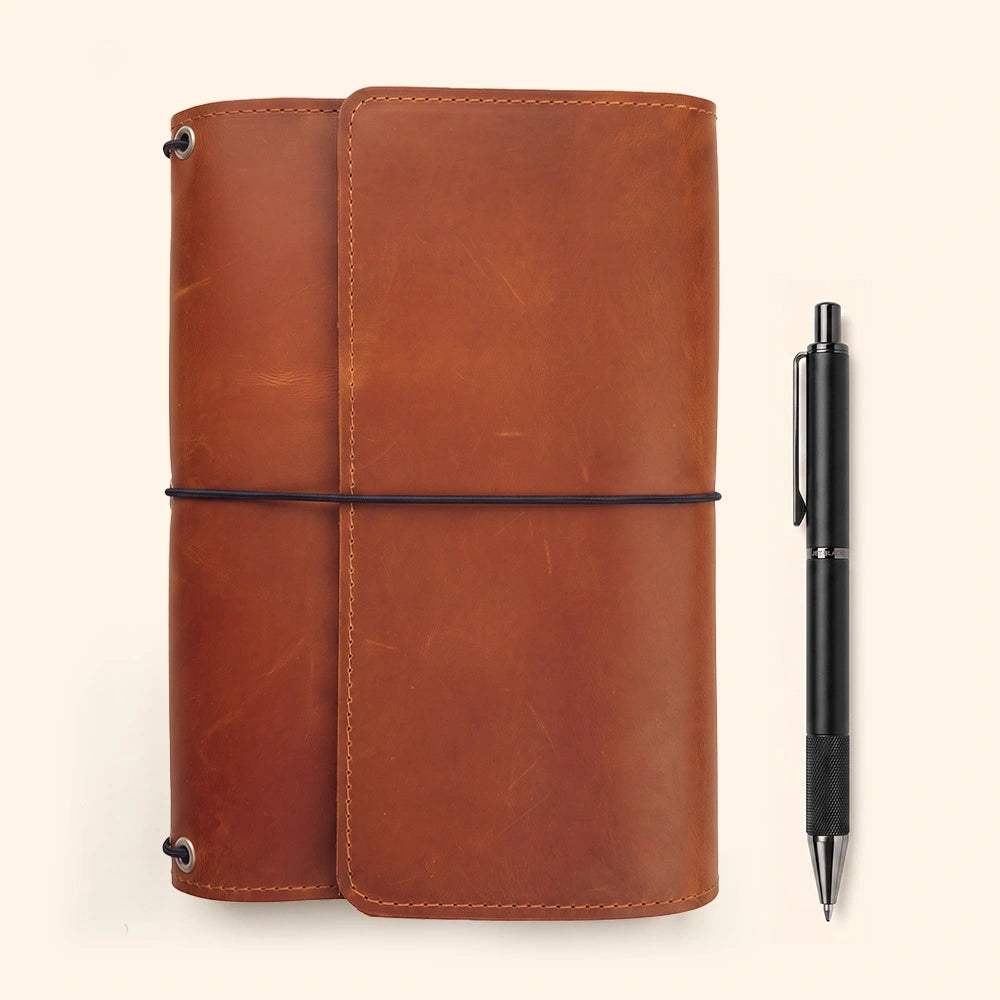 Natural leather notebook portfolio with interior card organization and leather pen loop.