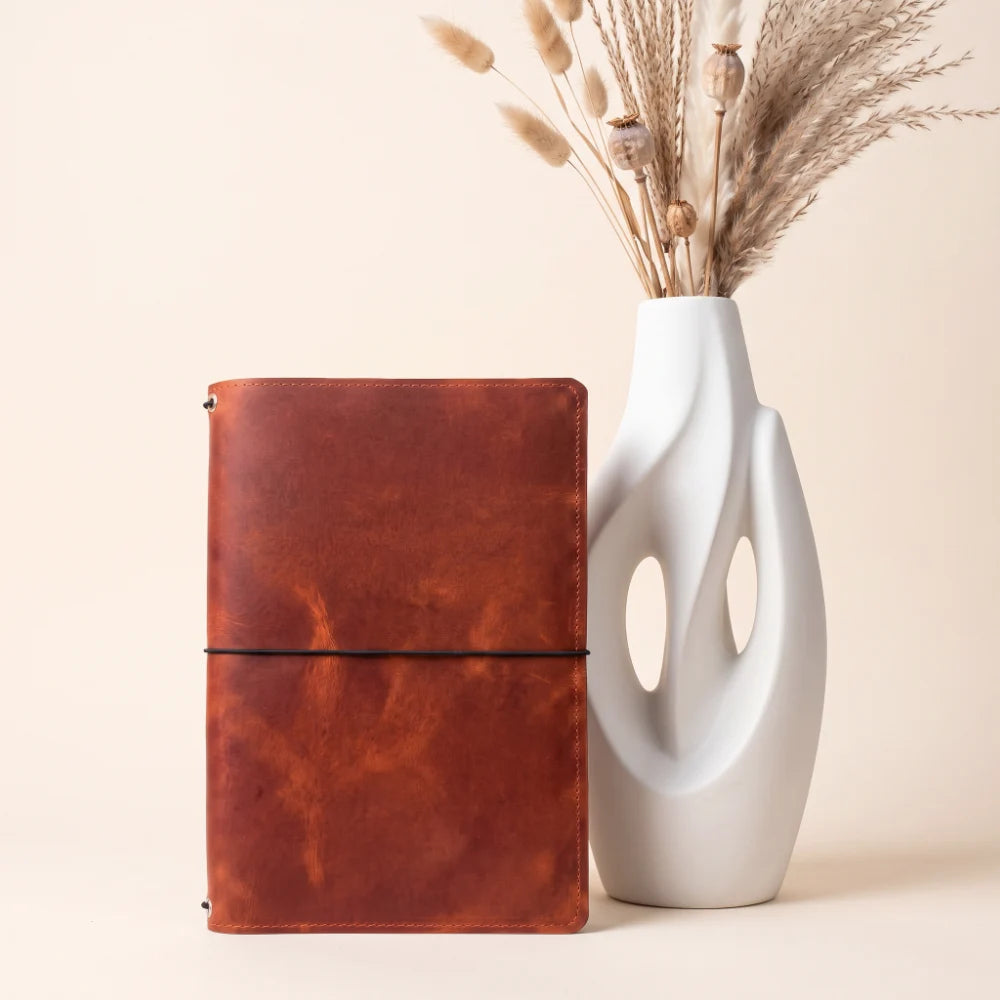 Natural leather notebook wrap featuring a practical three-cord interior system.