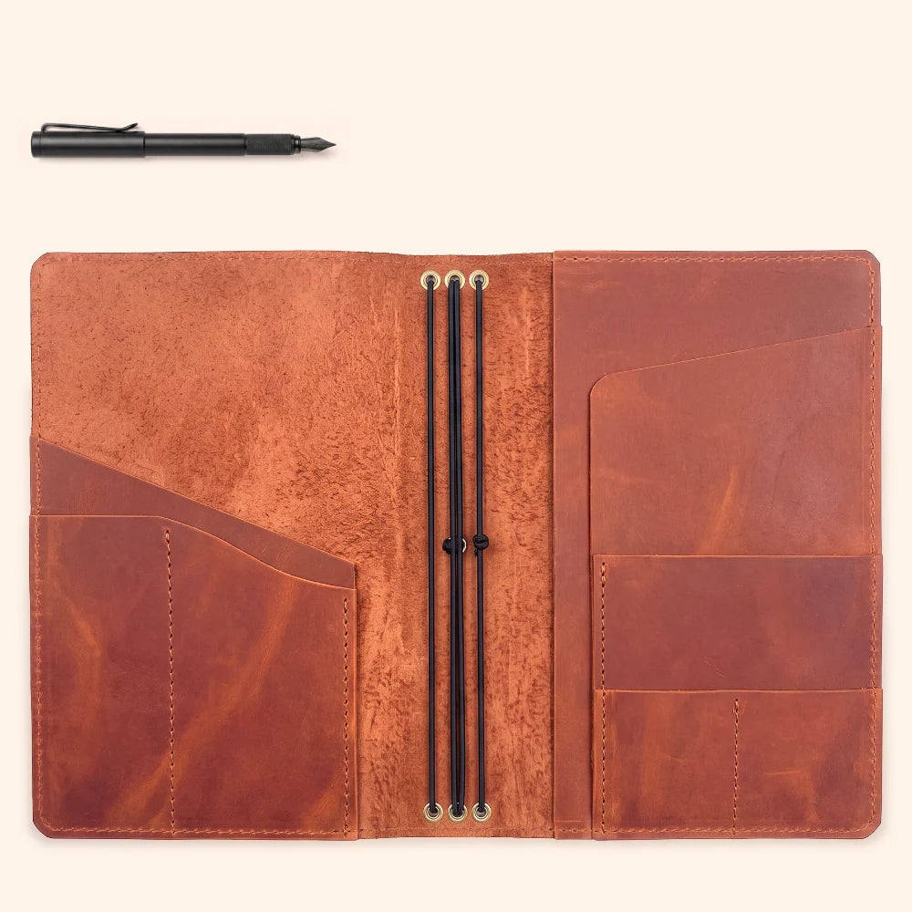 Leather notebook organizer featuring three flexible cords for removable paper refills.