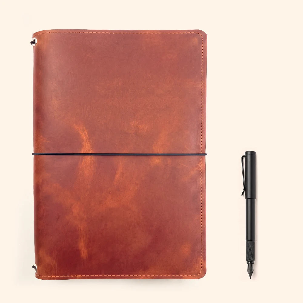 Leather insert organizer with triple elastic fastening for personalized journal layouts.