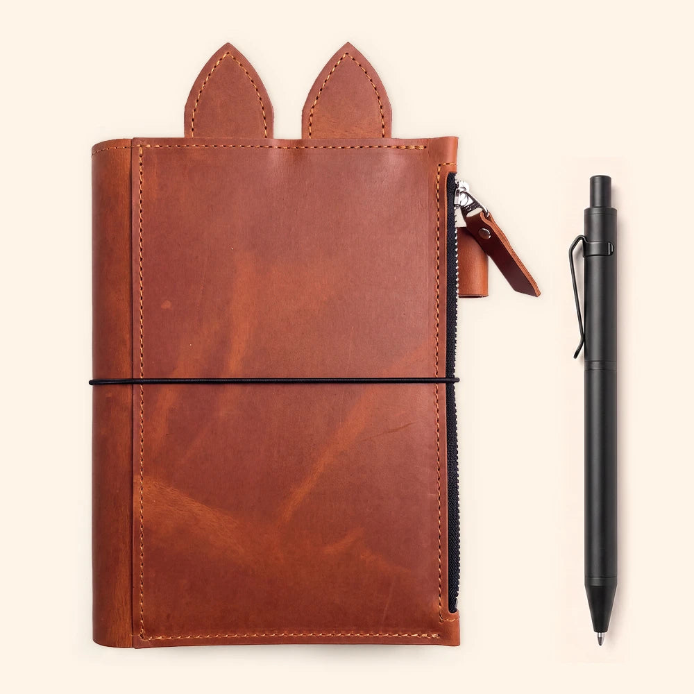 Genuine leather notebook case designed for organized writing supplies and refillable inserts.