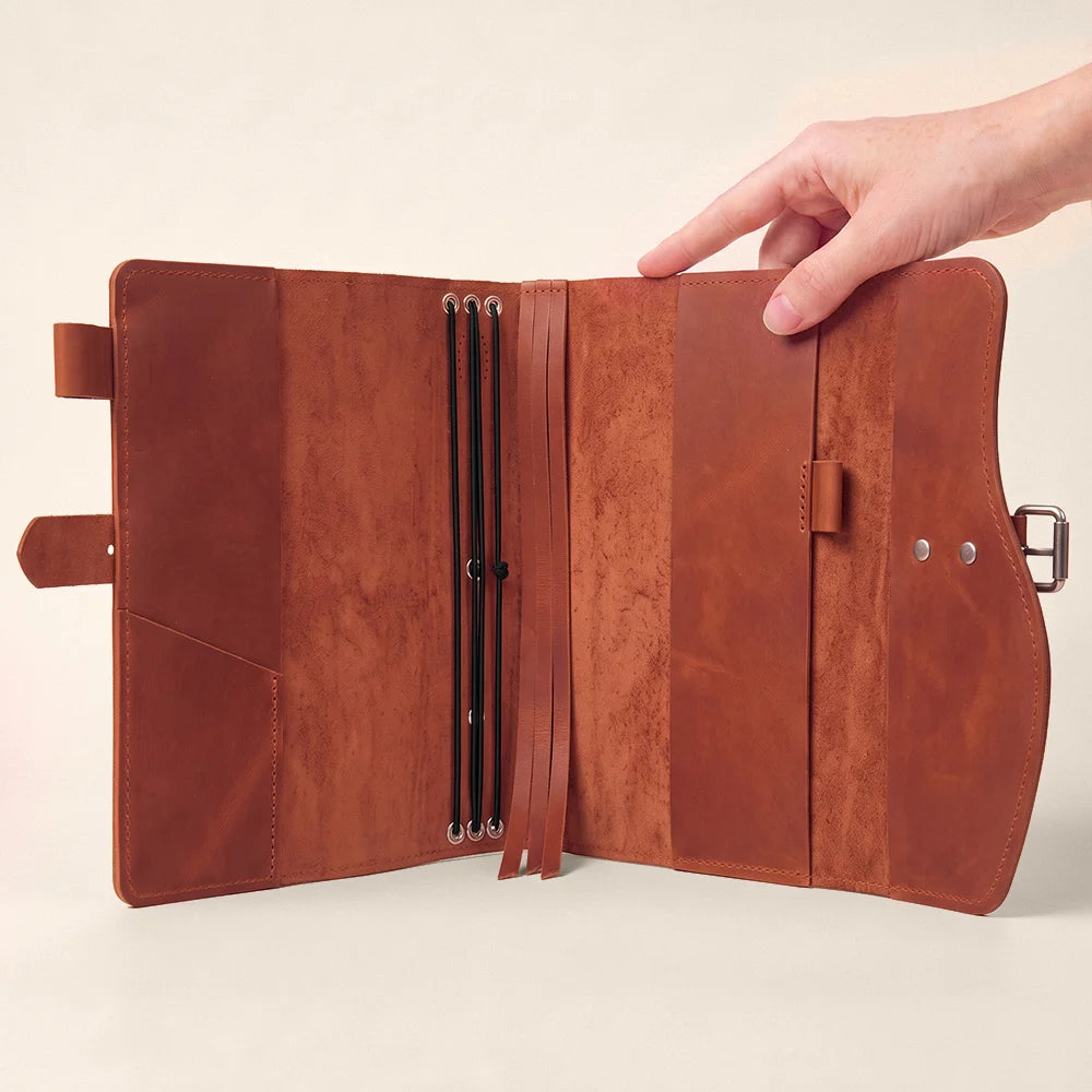 Leather writing cover featuring organized card pockets, elastic pen holder, ribbon marker, and portable outer handle.