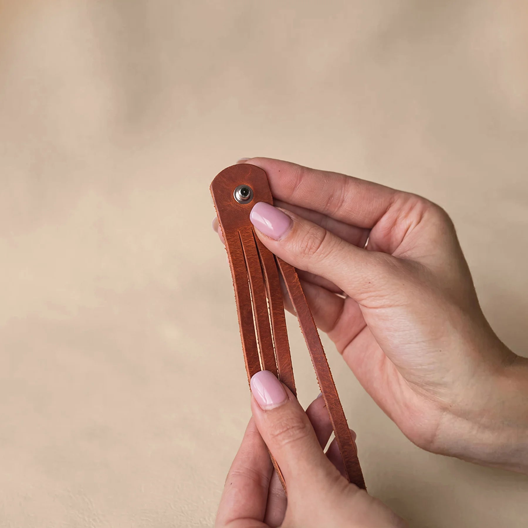 Premium natural leather bracelet with polished snap button and comfortable adjustable fit.