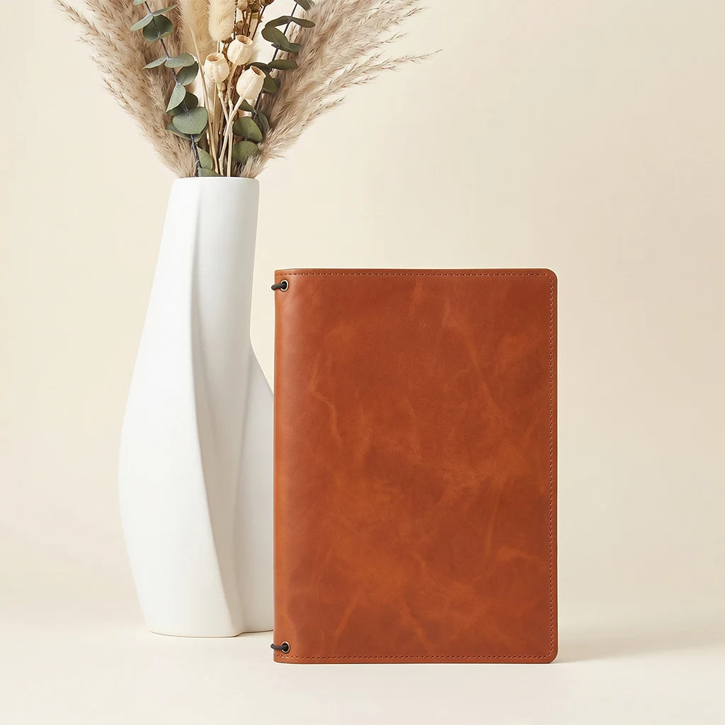 Handcrafted leather cover suitable for journals, planners, and travel notebooks.