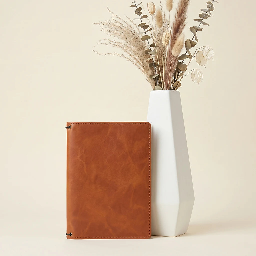 Refillable leather journal cover featuring card pockets and three elastic bands.