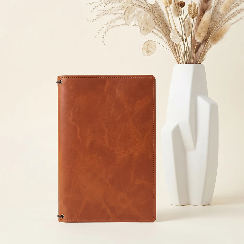 Leather notebook case designed to carry inserts, cards, and notes.