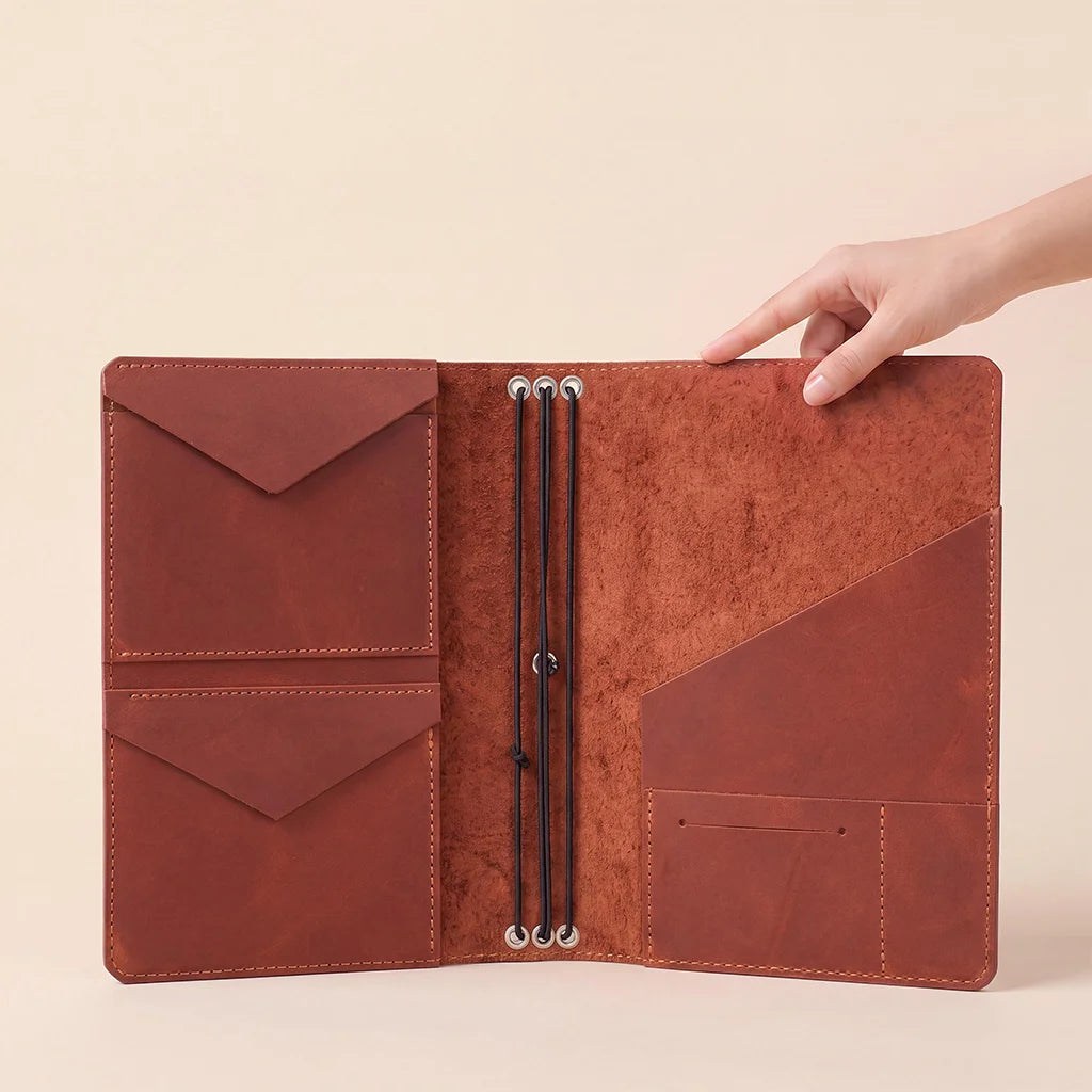 Leather planner organizer built with premium leather and flexible elastic notebook holders.