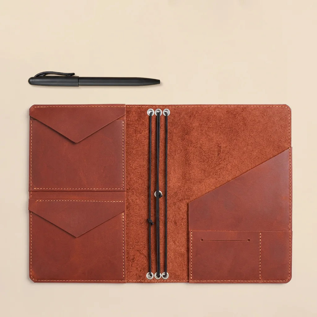 Genuine leather notebook organizer crafted with practical storage and refillable elastic holders.
