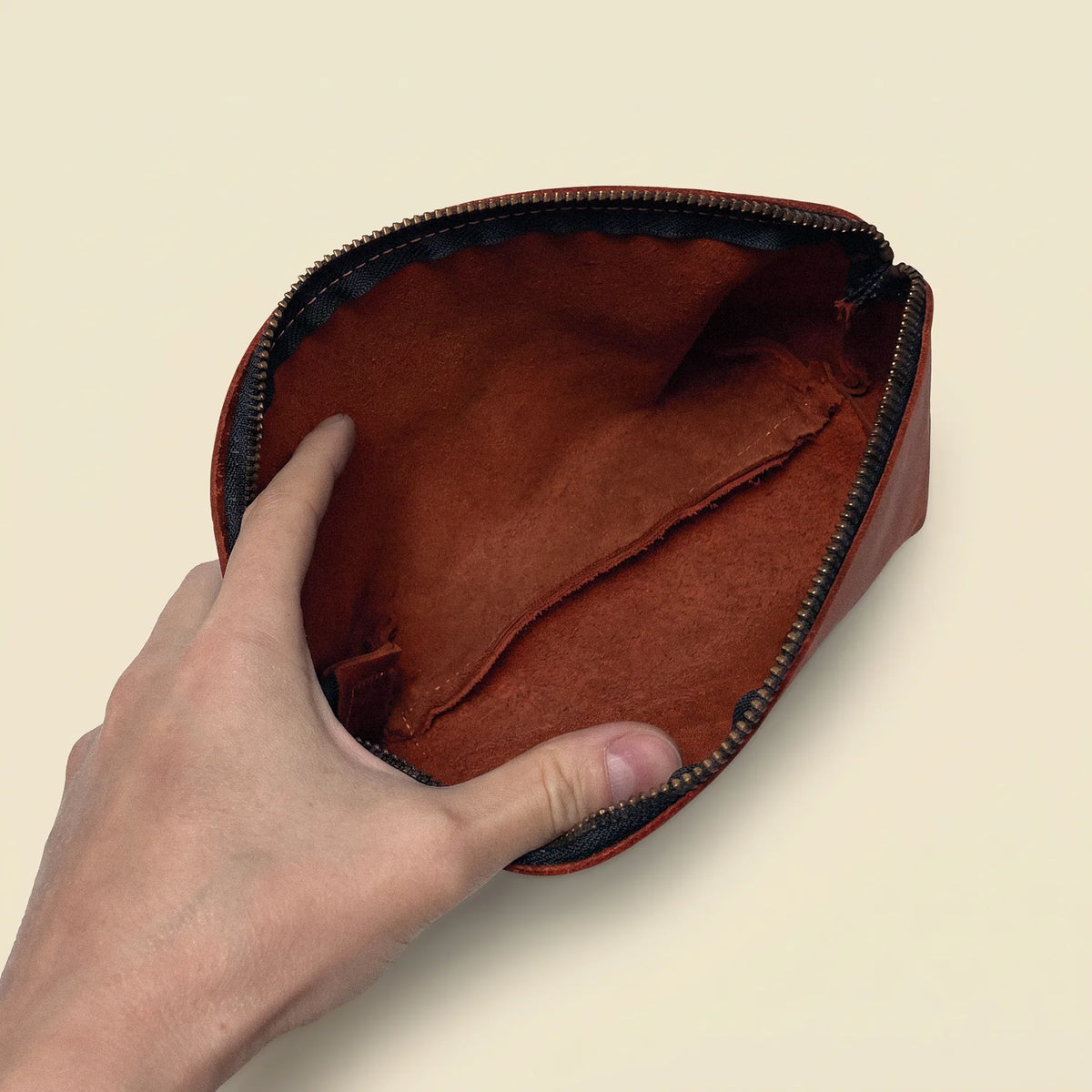 Premium leather cosmetic pouch with a secure zipper and timeless minimalist design