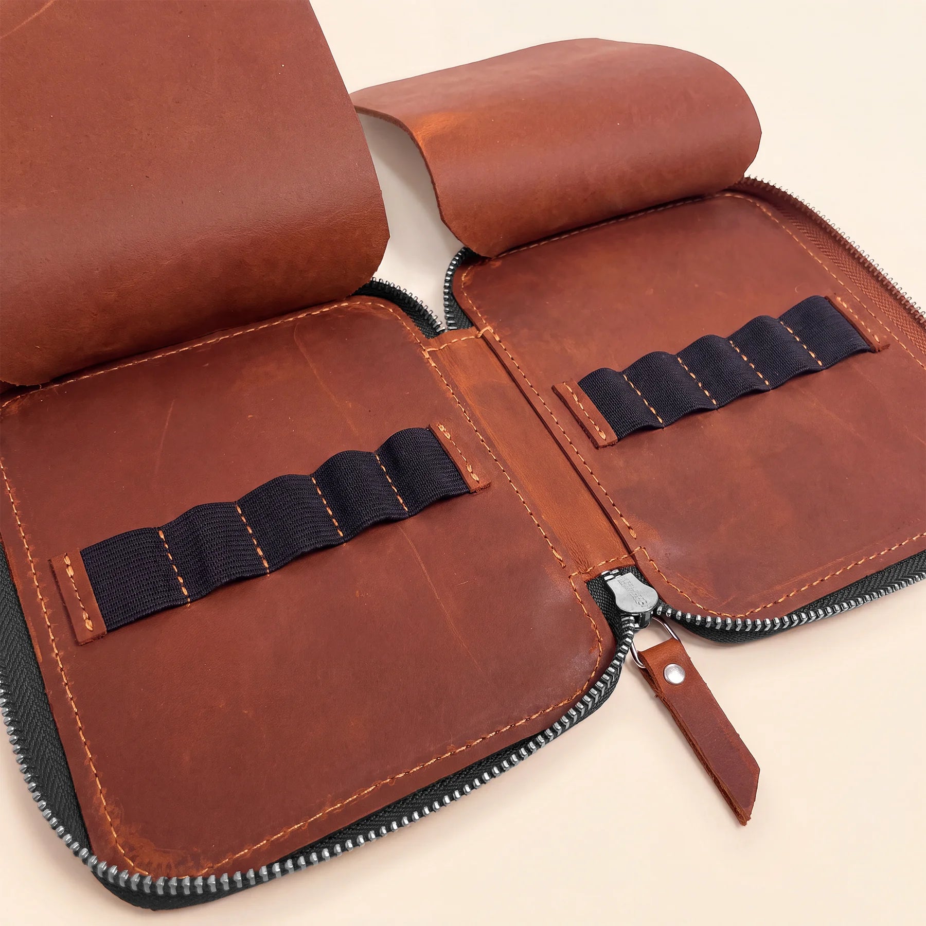 Genuine leather pen holder case with smooth zipper and durable handmade construction.