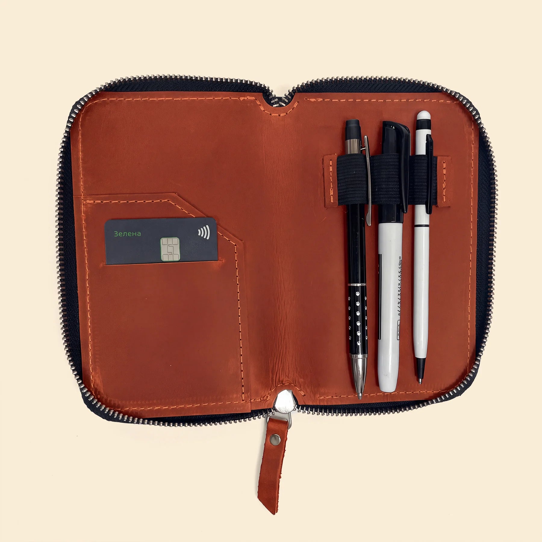 Elegant handcrafted leather pen pouch with zipper for professional desk organization.