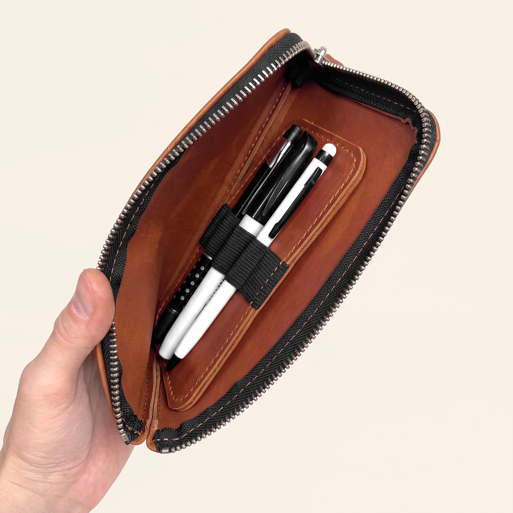 Leather pencil wallet with sturdy zipper crafted for lasting everyday performance.