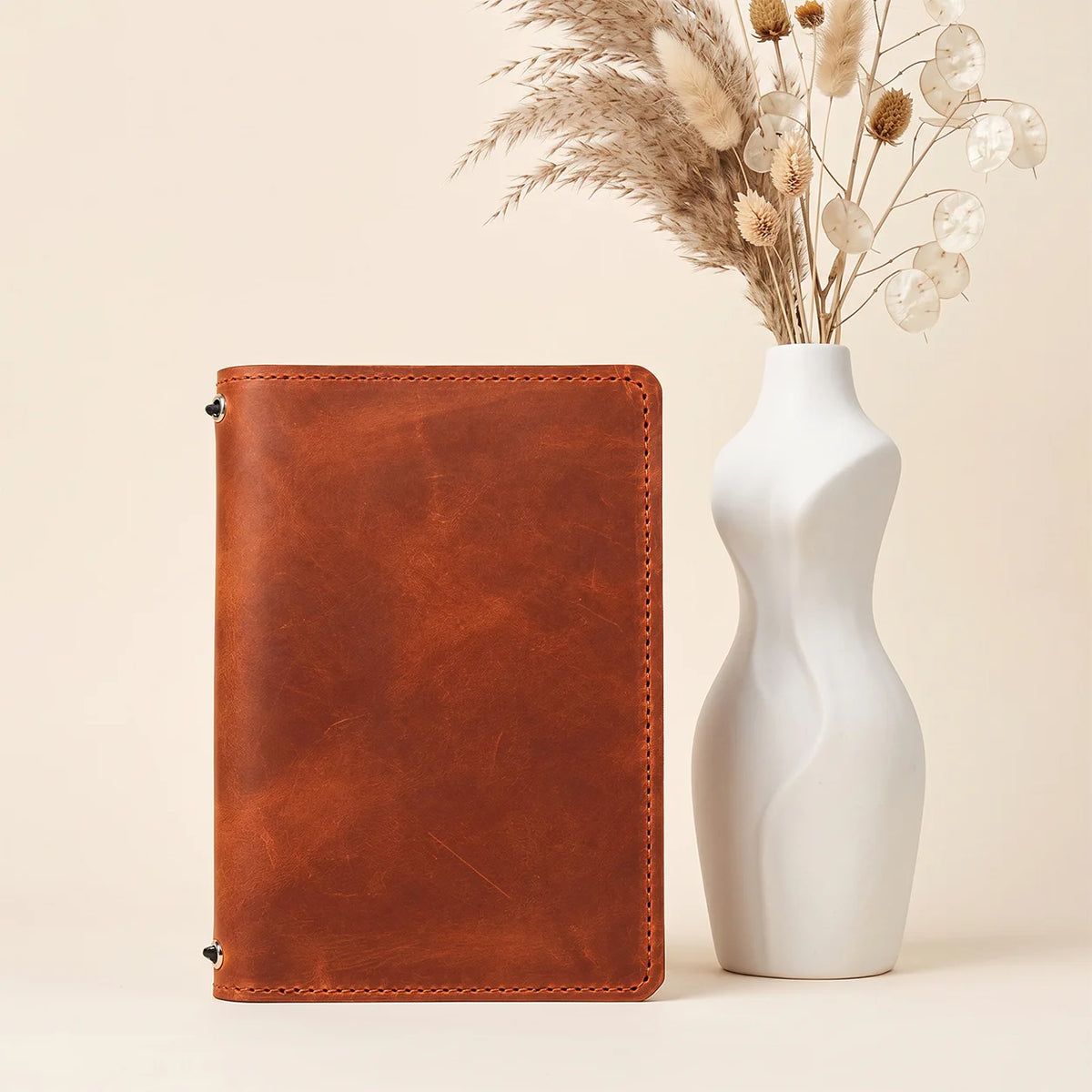 Rustic first grade leather notebook cover designed with two elastic retainers and pockets