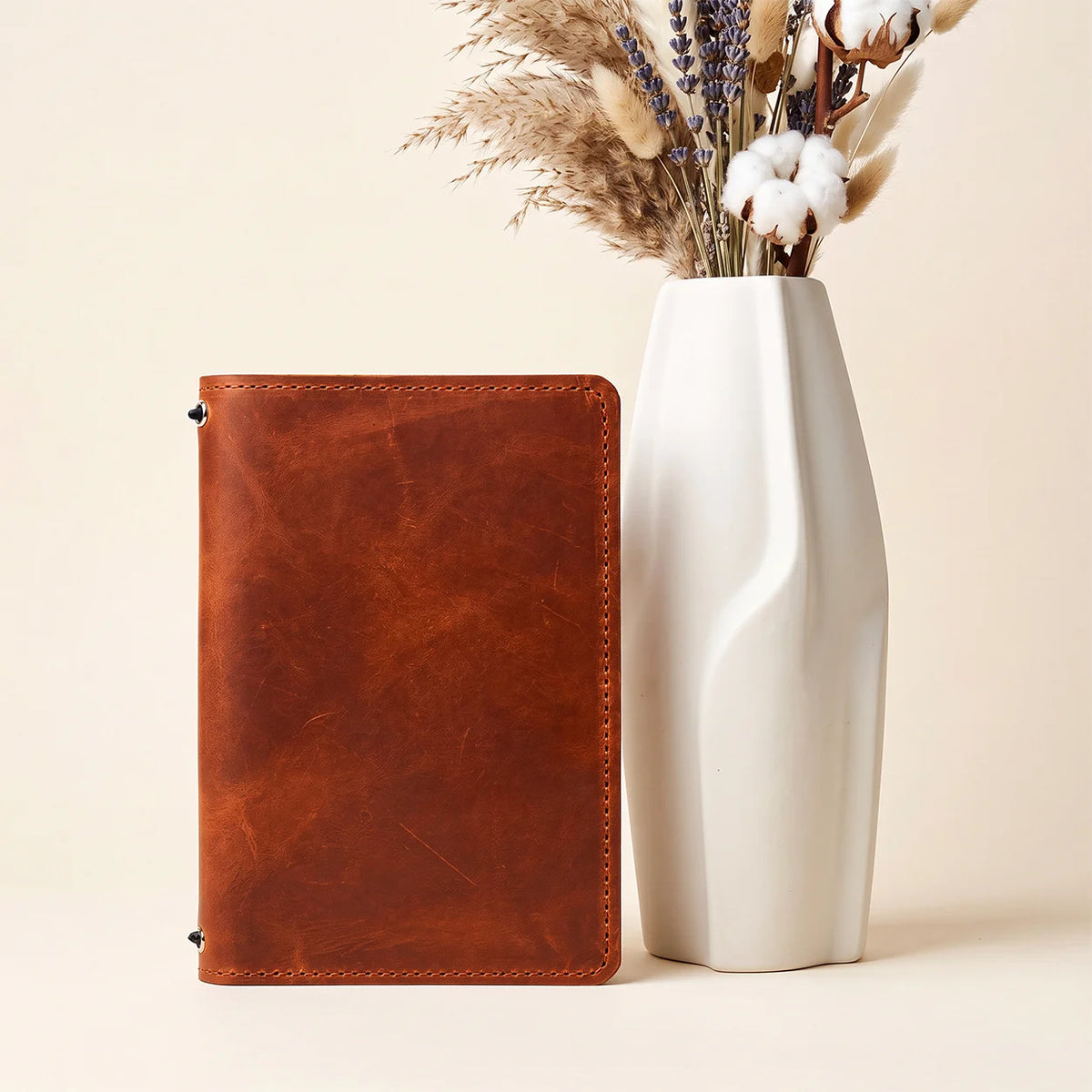 Natural leather journal cover with handcrafted finish, inner pockets, and elastic bands