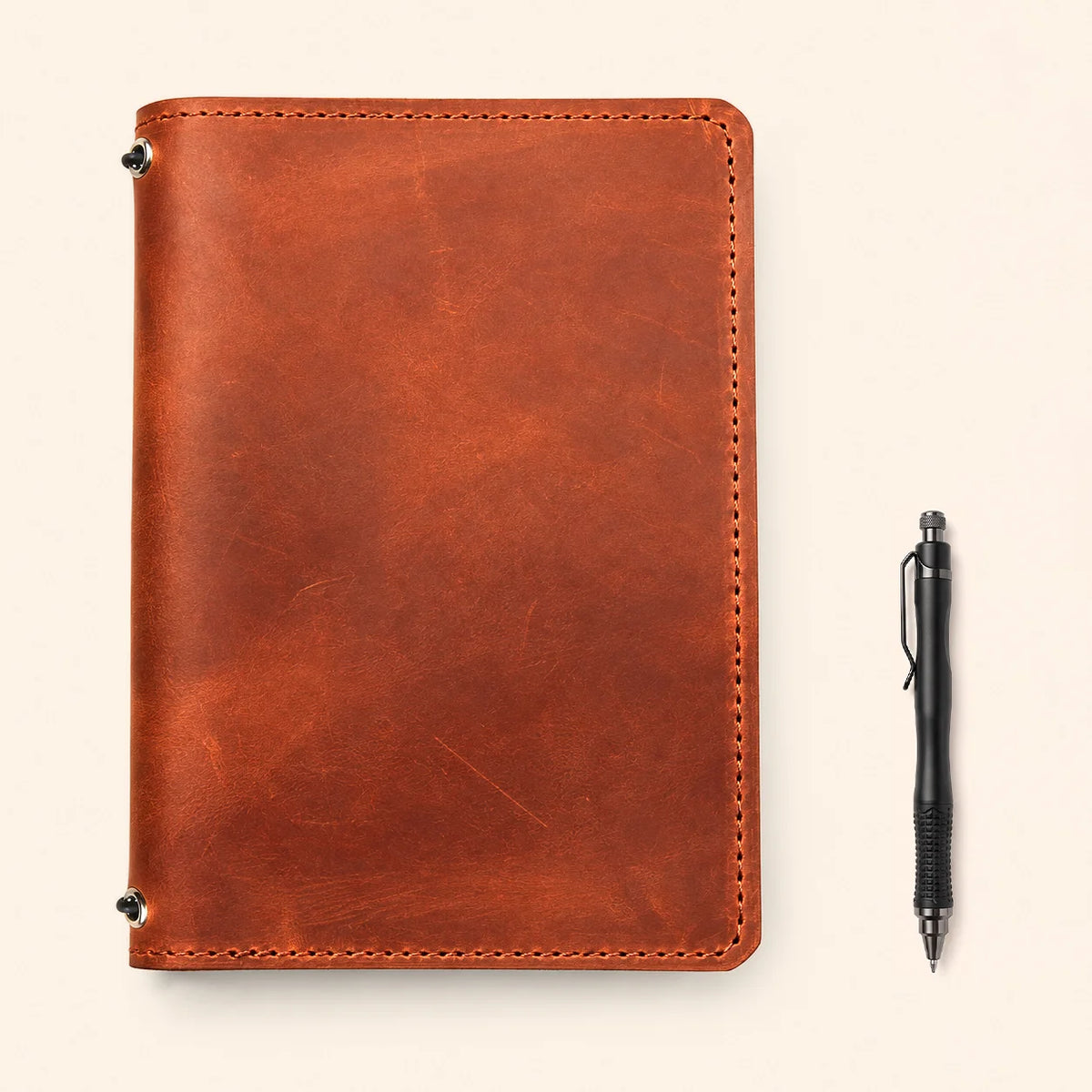 Rustic handmade leather notebook case with two elastic retainers and functional pocket layout