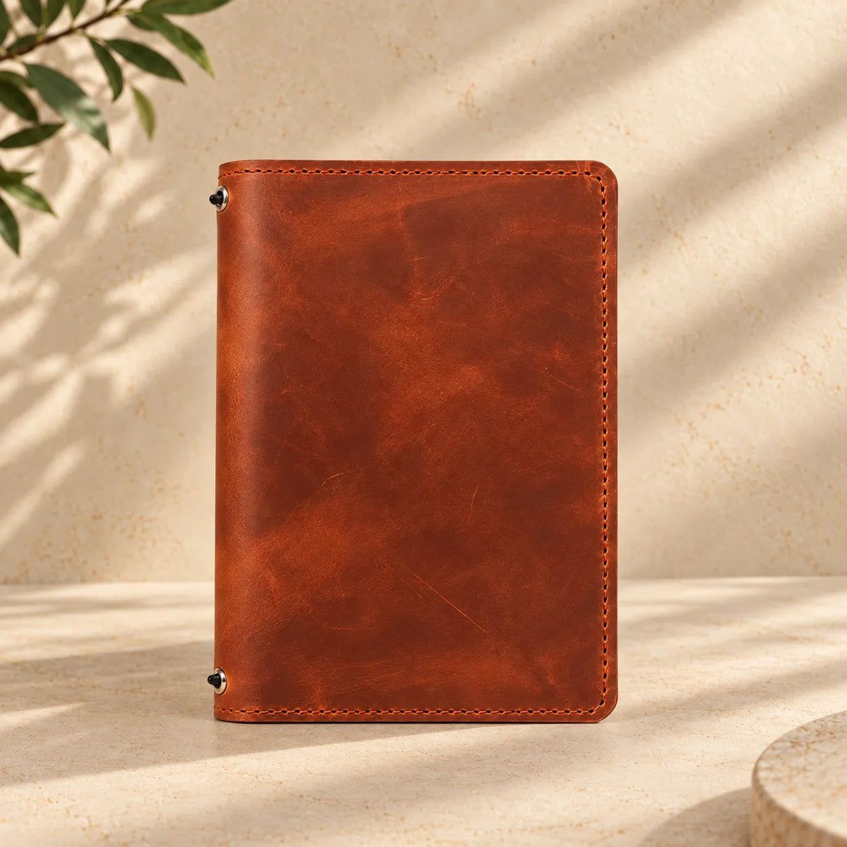 Natural leather journal cover featuring interior pockets and two practical elastic bands.