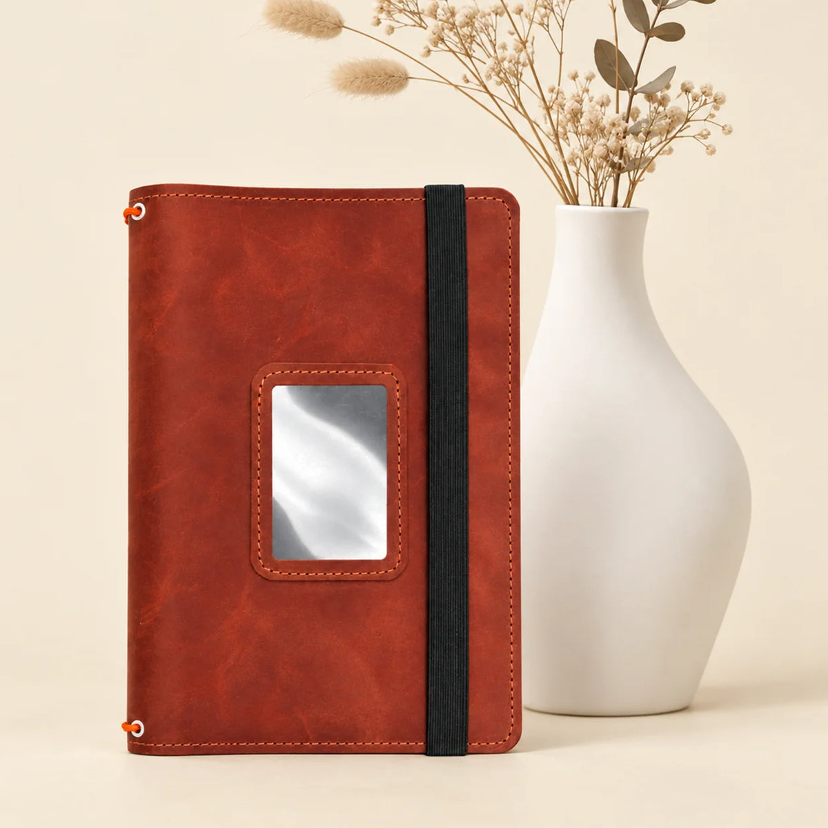 Genuine leather journal organizer featuring three bands and neatly integrated pockets for accessories.